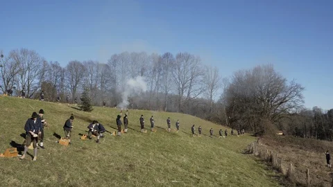 Austrian shooting team fires and reloads traditional black powder guns Stock Footage 120983114