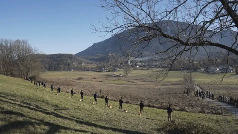 Austrian Shooting Team fires Black powder guns are watched in Austrian Alps Stock Footage 120982271