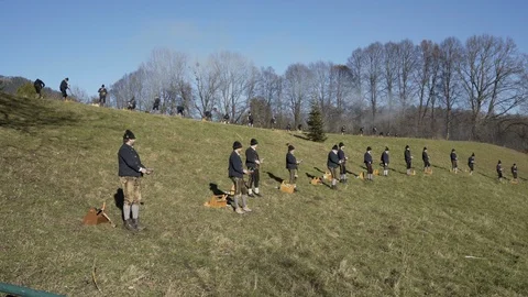 Austrian Shooting Team fires Black powder guns into sky in Austrian Alps Stock Footage 120989601