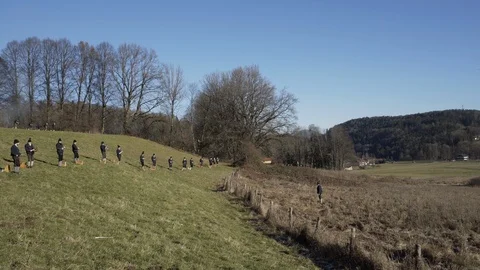 Austrian Shooting Team fires Black powder guns pan from conductor Stock Footage 120989648