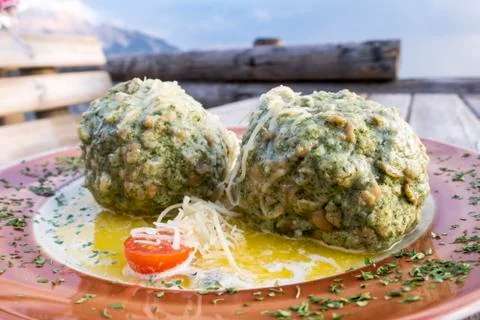 Austrian spinach dumplings on a table Stock Photos