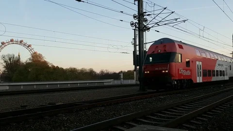 Austrian tram arriving at the station in front of the Riesenrad in Prater Park. Video stock 124026165
