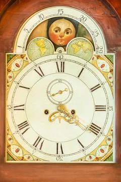 Authentic ancient clock with moon and star rotation in a wooden casing Foto stock