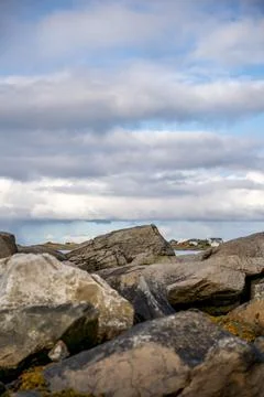 An authentic and captivating photograph of a rugged Nordic coastline, featuri Stock Photos