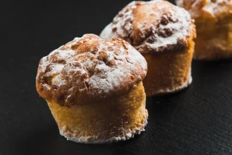 Authentic artisans muffins on black background Photos