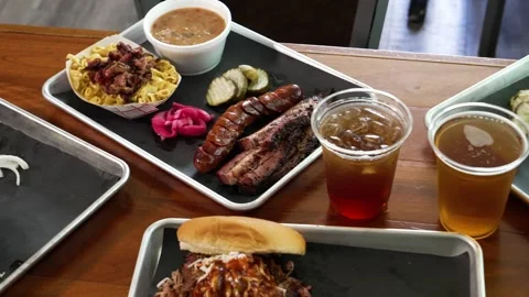 Authentic Barbecue Menu with Brisket, Sausage, Sides, and Sandwiches on Wooden Stock Footage 346416952
