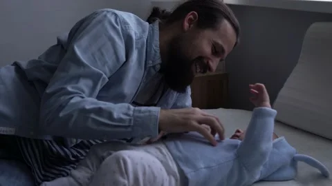 Authentic Bearded Long-haired Young Neo Father And Newborn Baby Looking Each Stock-Footage 168151971