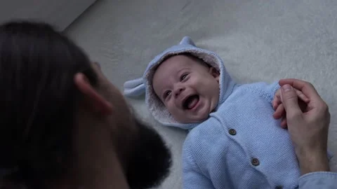 Authentic Bearded Long-haired Young Neo Father And Newborn Baby Looking Each Stock Footage 168151987