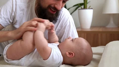Authentic Bearded Long-haired Young Neo Father And Newborn Baby Looking Each Stock Footage 198527966