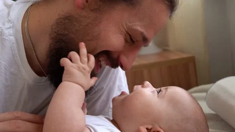 Authentic Bearded Long-haired Young Neo Father And Newborn Baby Looking Each Stock Footage 198934211