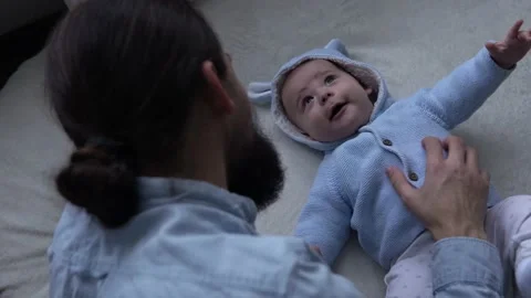 Authentic Bearded Long-haired Young Neo Father And Newborn Baby Looking Each Stock Footage 198934308