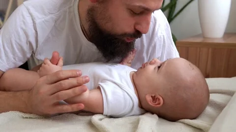 Authentic Bearded Long-haired Young Neo Father And Newborn Baby Looking Each Stock Footage 201022830