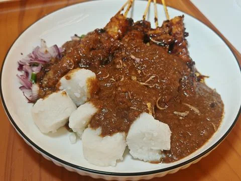Authentic Beef Satay or Chicken Satay with Lontong and Rich Peanut Sauce Stock Photos