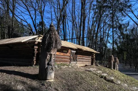 Authentic beehive made of logs. The old apiary. Stock Photos