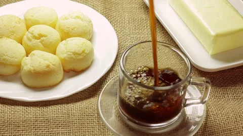 Authentic Brazilian cheese bread served with butter on a rustic burlap Видео 337274648