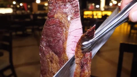 Authentic Brazilian Churrascaria Table-Side Meat Carving Experience Stock-Footage 332812966