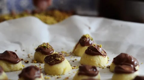 Authentic chocolate making by skilled artisan chef, sprinkling confectionery Stock Footage 66399725