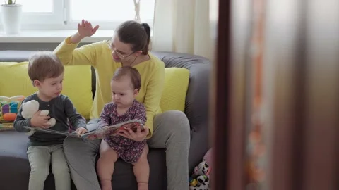 Authentic close up cute neo caucasian spectacled mom with 2 children boy and Stock Footage 149357860
