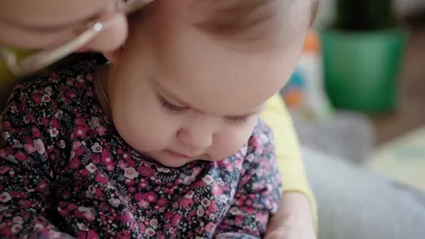Authentic close up shot of young caucasian mother caressing song active exercise Stock Footage 149374637
