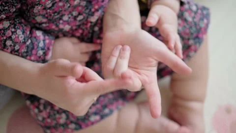Authentic close up shot of young caucasian mother caressing song active exercise Stock Footage 149441525