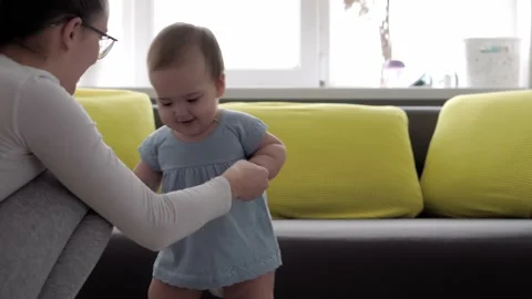 Authentic close up shot of young neo caucasian mother keeping in arms and Video stock 148790112