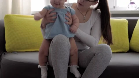 Authentic close up shot of young neo caucasian mother keeping in arms and Stock Footage 148891757
