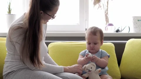 Authentic close up shot of young neo caucasian mother keeping in arms and Stock Footage 149150245