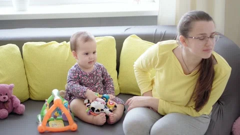 Authentic close up shot of young neo caucasian mom play have fun spend time Stock Footage 149441544