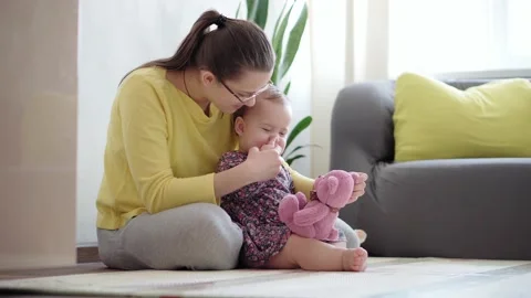 Authentic close up shot of young neo caucasian mother keeping in arms and Stock Footage 149934336