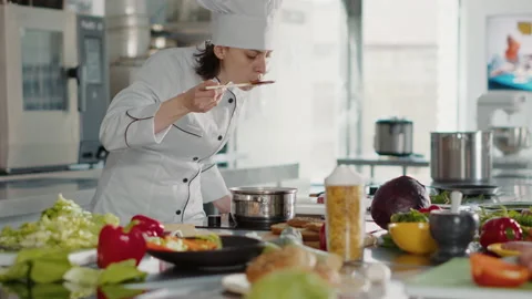 Authentic cook taste testing bad sauce on kitchen stove 스톡 동영상 174667014