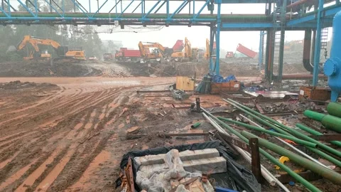Authentic Crane Operator POV of Dump Truck and Excavators Working During Heavy R Stock Footage 340069434