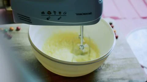 Authentic culinary sequence of cracking an egg into the bowl 스톡 사진