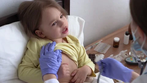 Authentic cute caucasian cute young woman nurse or doctor pediatrician examine Stock Footage 152265901