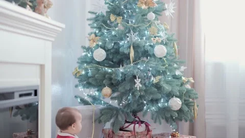 Authentic cute happy Joy chubby infant girl wearing santa hat and red dress Stock Footage 153436935