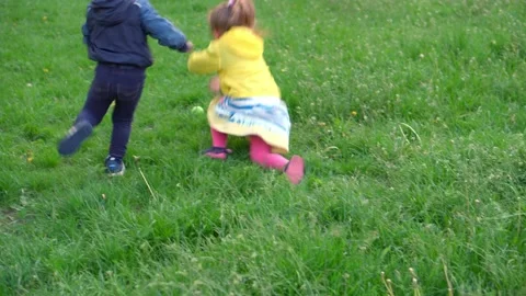 Authentic cute two little preschool sibling children girl and boy walking in Stock Footage 155555261