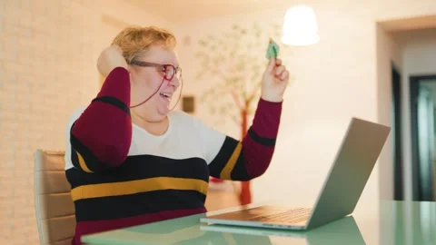 Authentic E-Commerce Senior Woman Shops from Home Stock Footage 304822516
