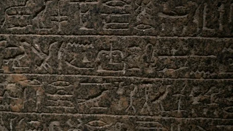 Authentic Egyptian hieroglyphs writing in stone Stock Footage 86485608
