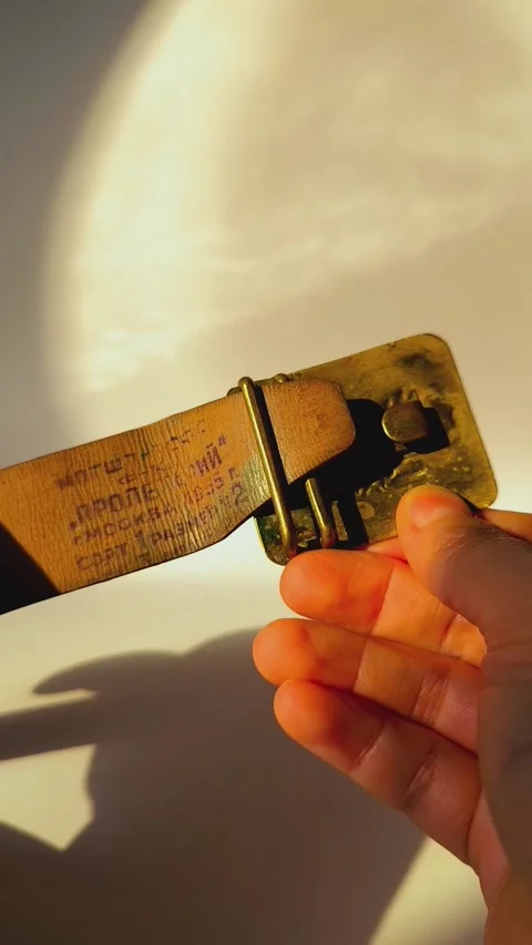 Authentic factory stamp on the inner side of vintage leather belt. Stock Footage 330038349