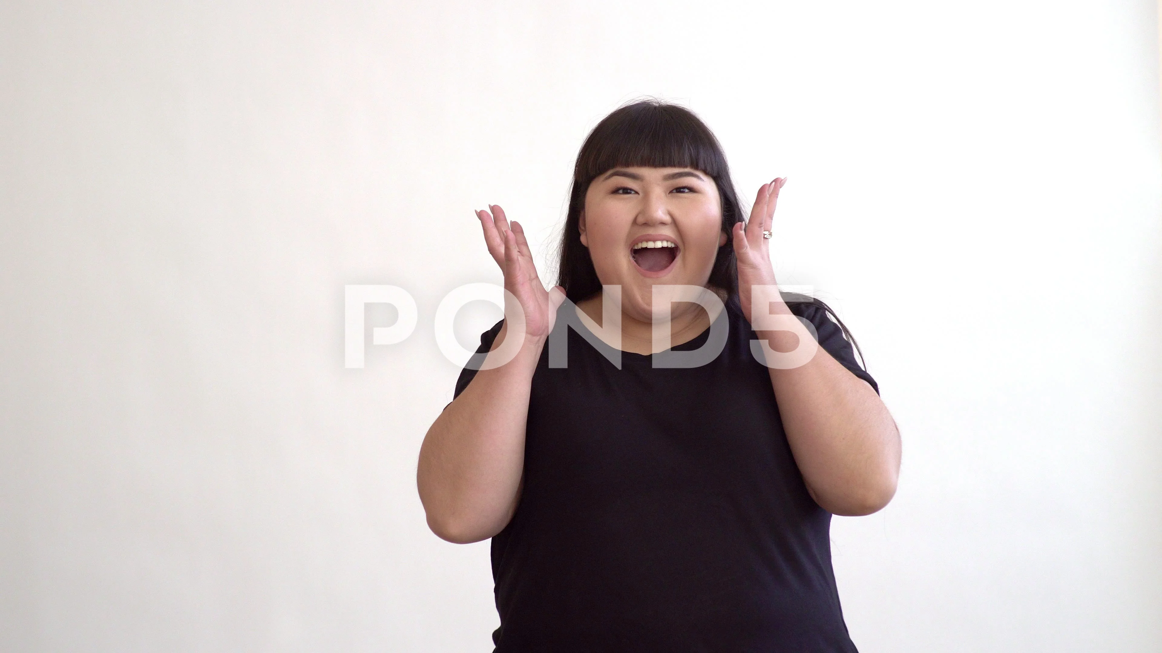 authentic fat Asian girl dancing and enjoying life on white background. Life