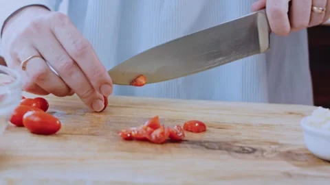 Authentic finished meal angle: adding walnuts and spices to the sauce Stock Footage 342200970