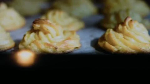 Authentic fresh assembly: baking duchess potatoes until golden Stock Photos