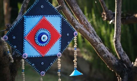 Authentic garden tree ornament evil eye bead Stock Photos