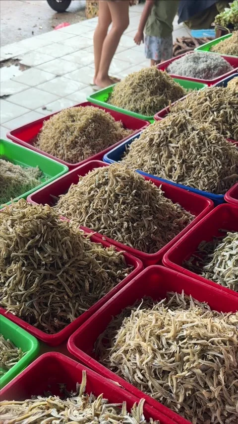 An authentic glimpse into a bustling open-air market, where colorful contai.. Video stock 337284584