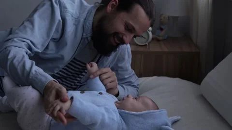 Authentic Happy Bearded Long-haired Young Neo Father And Newborn Baby Holding Stock Footage 167978649