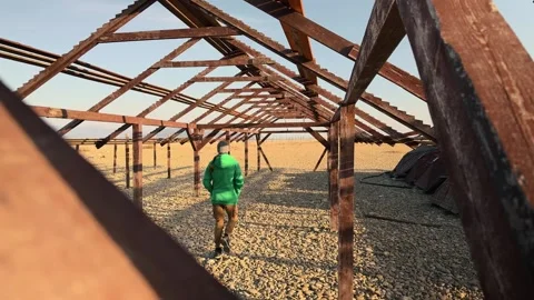 Authentic High Angle Shot Of Man Walking Away Through Symmetrical Timber Tr.. 스톡 동영상 330857098