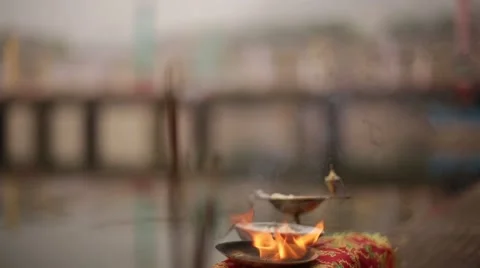 Authentic Holy incense stick lighting near Ganga River in Indian Temple Stock Footage 55552995