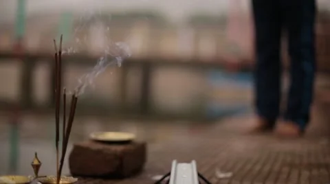 Authentic Holy incense stick lighting near Ganga River in Indian Temple Stock Footage 55556522