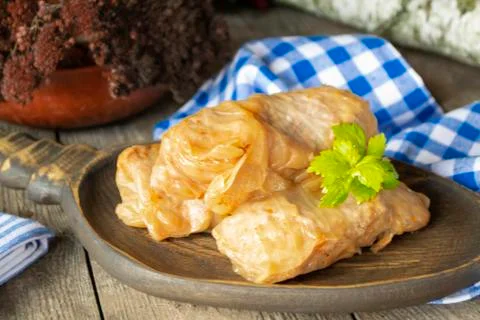 Authentic homemade stuffed cabbage rolls on wooden table Stock Photos