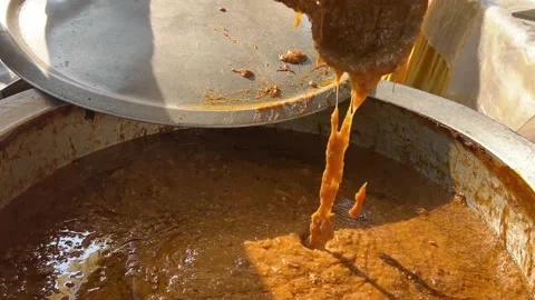 The authentic Hyderabadi Haleem is being stirred to show the fine mutton Stock Footage 307174444