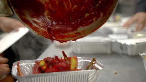 Authentic indian curry Takeaway being packaged up Stock Footage